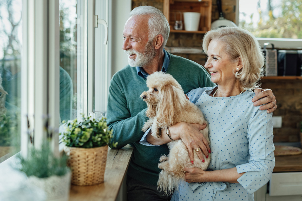 senior couple with pet